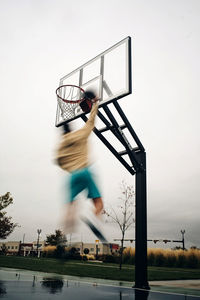 Low angle view of basketball hoop against sky
