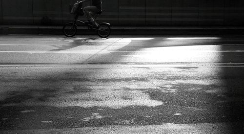 Low section of man riding bicycle