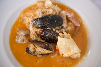Close-up of seafood curry served in plate on table