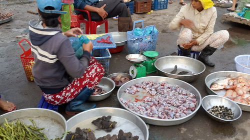 Woman eating food in bowl