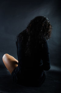 Midsection of shirtless man