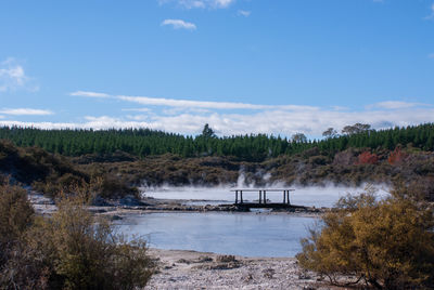 Scenic view of hot springs against sky