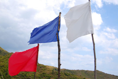 Low angle view of flag against sky