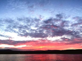 Scenic shot of calm lake at sunset