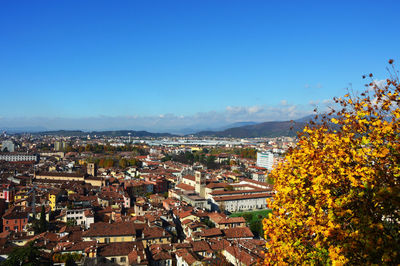 View of cityscape against blue sky