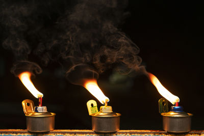 Close-up of burning candles