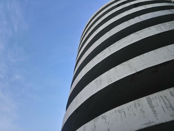 Low angle view of modern building against clear blue sky