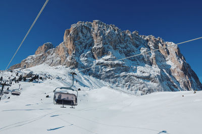 Overhead cable car against sky during winter