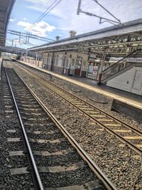 Railroad tracks on railroad station platform