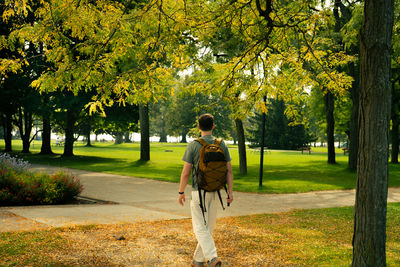 Rear view of woman walking in park