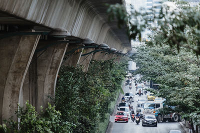 Cars on street amidst buildings in city