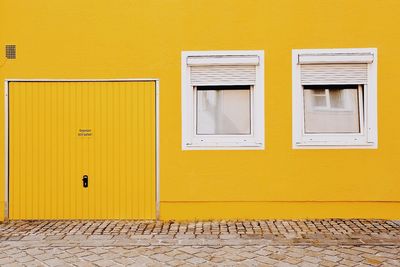 View of windows on yellow wall