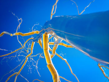 Low angle view of vapor trail against clear blue sky