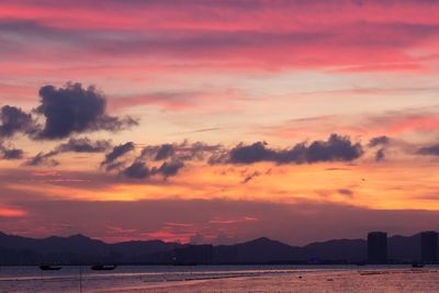 Scenic view of dramatic sky over sea during sunset