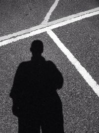 Shadow of people on road