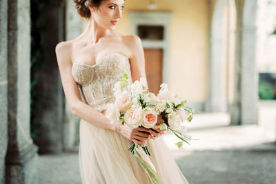 Young woman holding bouquet