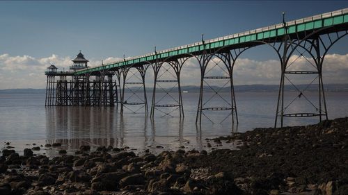 Bridge over sea against sky