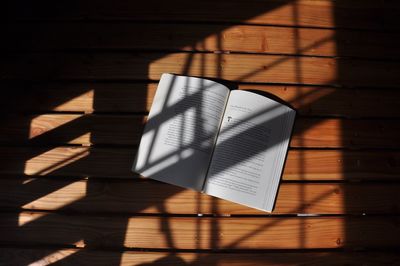 High angle view of sunlight falling on novel