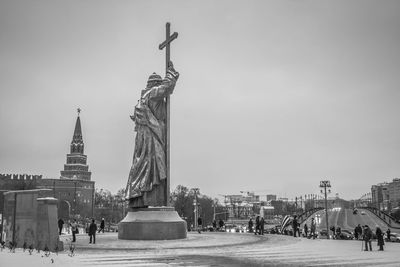 Statue of liberty against sky in city