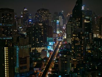 Aerial view of city lit up at night