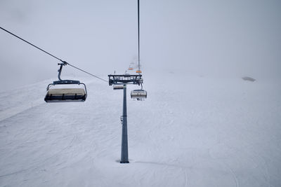 Ski lift on zugspitze, the only glacier ski area in germany. it was a cloudy and foggy day.