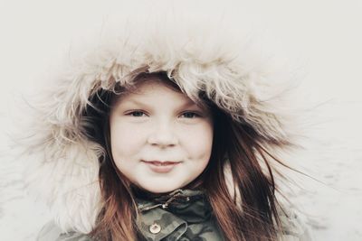 Portrait of a smiling young woman in winter