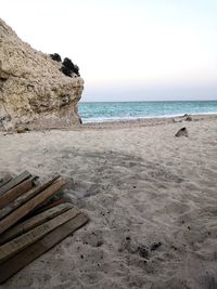 Scenic view of beach against clear sky