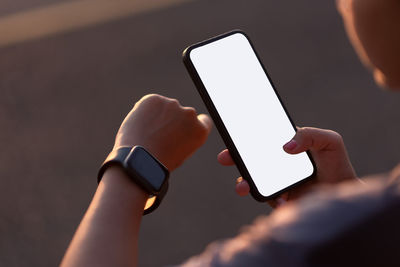 Close-up of person using mobile phone