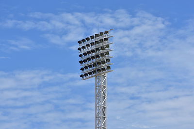 Low angle view of communications tower against sky