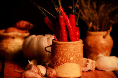Close-up of red chili peppers on table