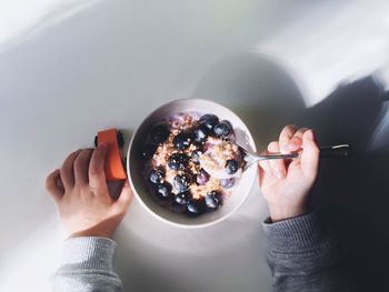 Cropped image of hand holding food