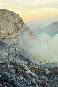 Scenic view of snowcapped mountains against sky during sunset