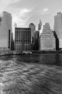 Modern buildings in city against sky