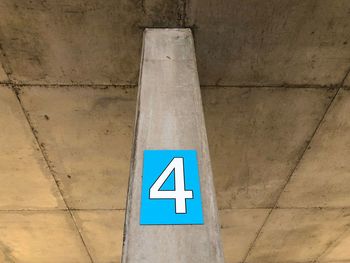 Low angle view of sign on wall