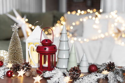 Illuminated christmas decorations on table