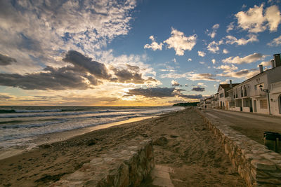 Scenic view of beach against sky during sunset