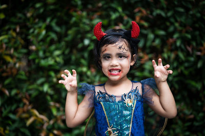 Portrait of cute girl in halloween costume.