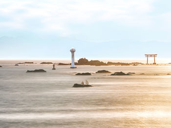 Scenic view of sea against cloudy sky