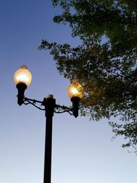 Low angle view of street light against sky