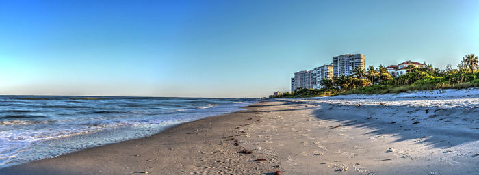 Scenic view of beach against clear sky