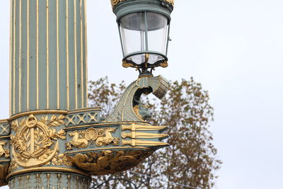 Low angle view of street light against sky