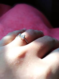 Close-up of person hand holding ring