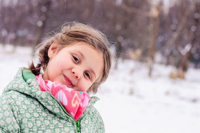 Portrait of smiling girl in snow