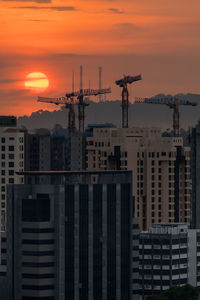 Buildings against sky during sunset