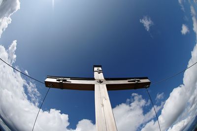 Low angle view of windmill against sky