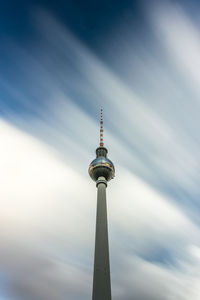 Low angle view of fernsehturm tv tower in berlin, against sky