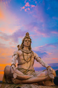 Low angle view of statue against sky