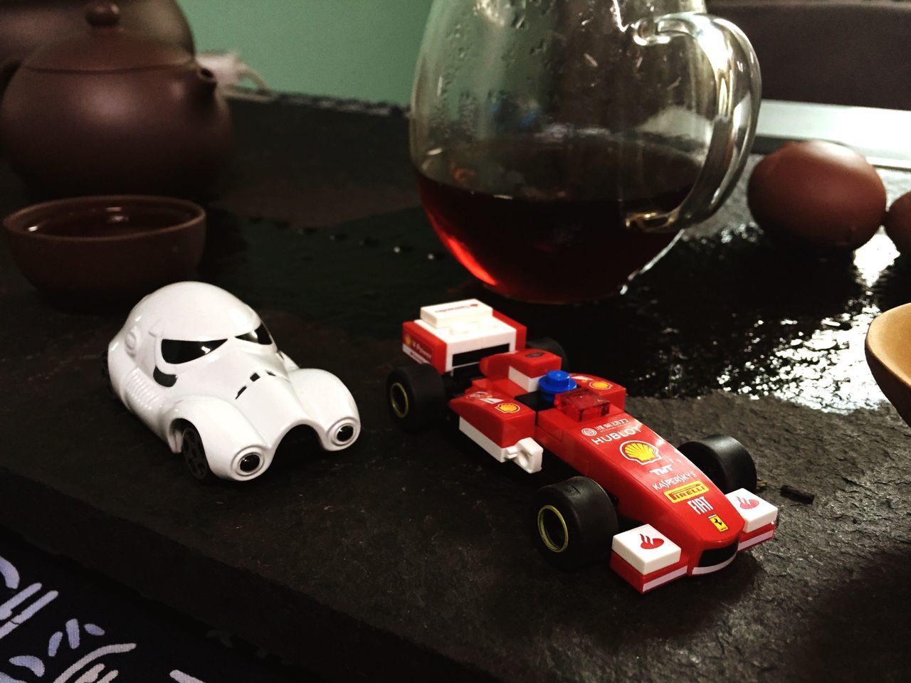 indoors, still life, high angle view, close-up, table, technology, toy, bottle, glass - material, no people, transparent, variation, red, wine, wineglass, plastic, day, focus on foreground, equipment, reflection