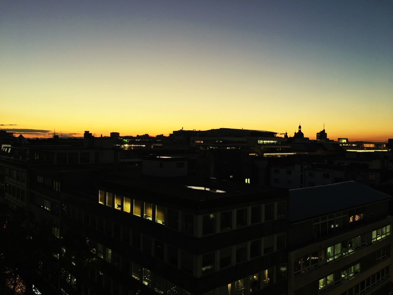 building exterior, built structure, city, sunset, architecture, transportation, high angle view, sky, outdoors, no people, cityscape