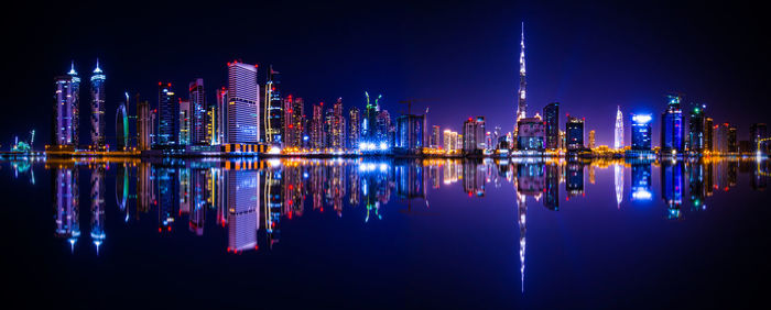 Illuminated buildings in city at night